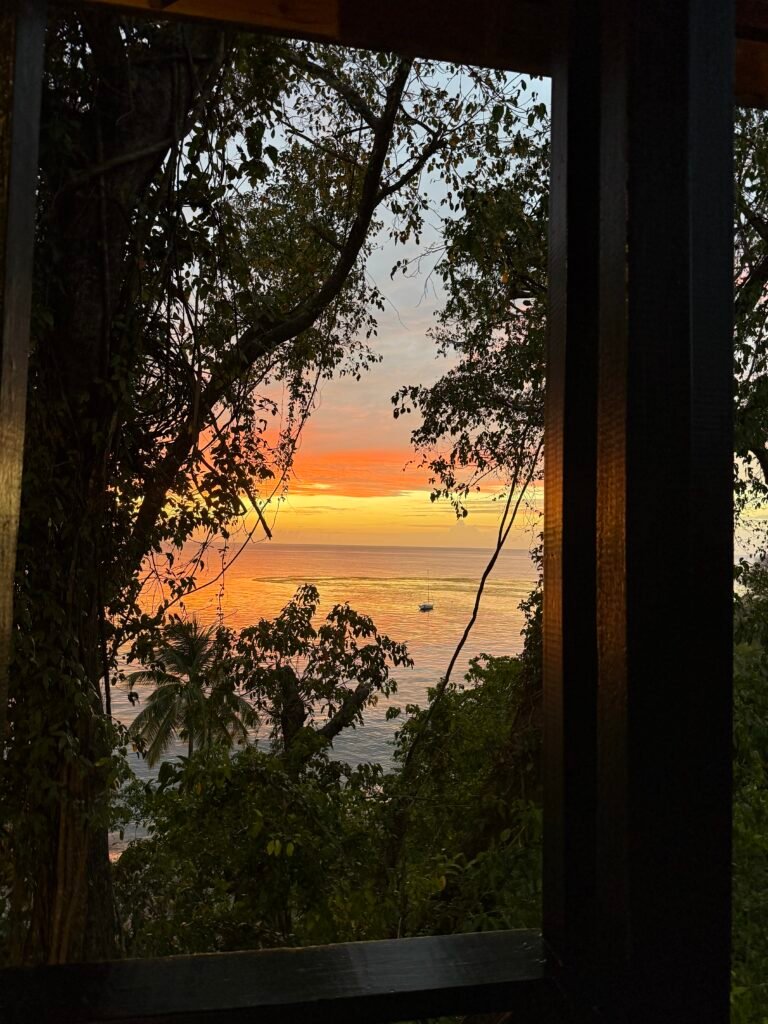 Cross silhouette at sunset representing strength through Christ